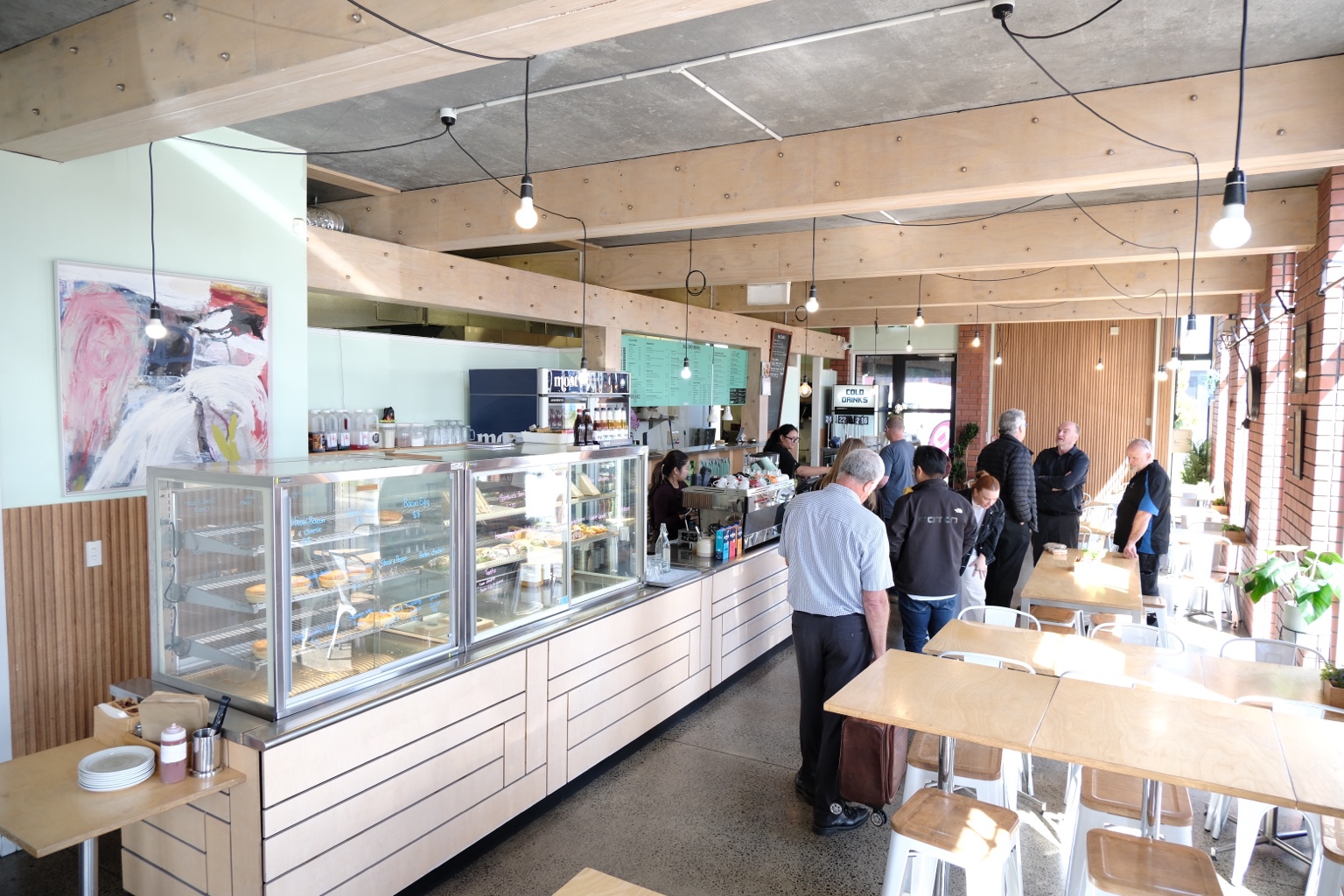 Customers gathering at the Coffee Nation counter